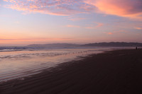 Sunset and waders at Pismo Beach California