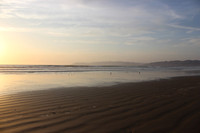 Sunset and waders at Pismo Beach California